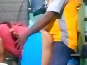 A mature Indian woman is vigorously penetrated by a nearby university-aged man in her absence